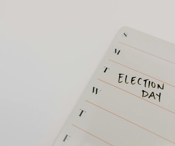 A calendar with three days marked for workouts, symbolizing consistency.